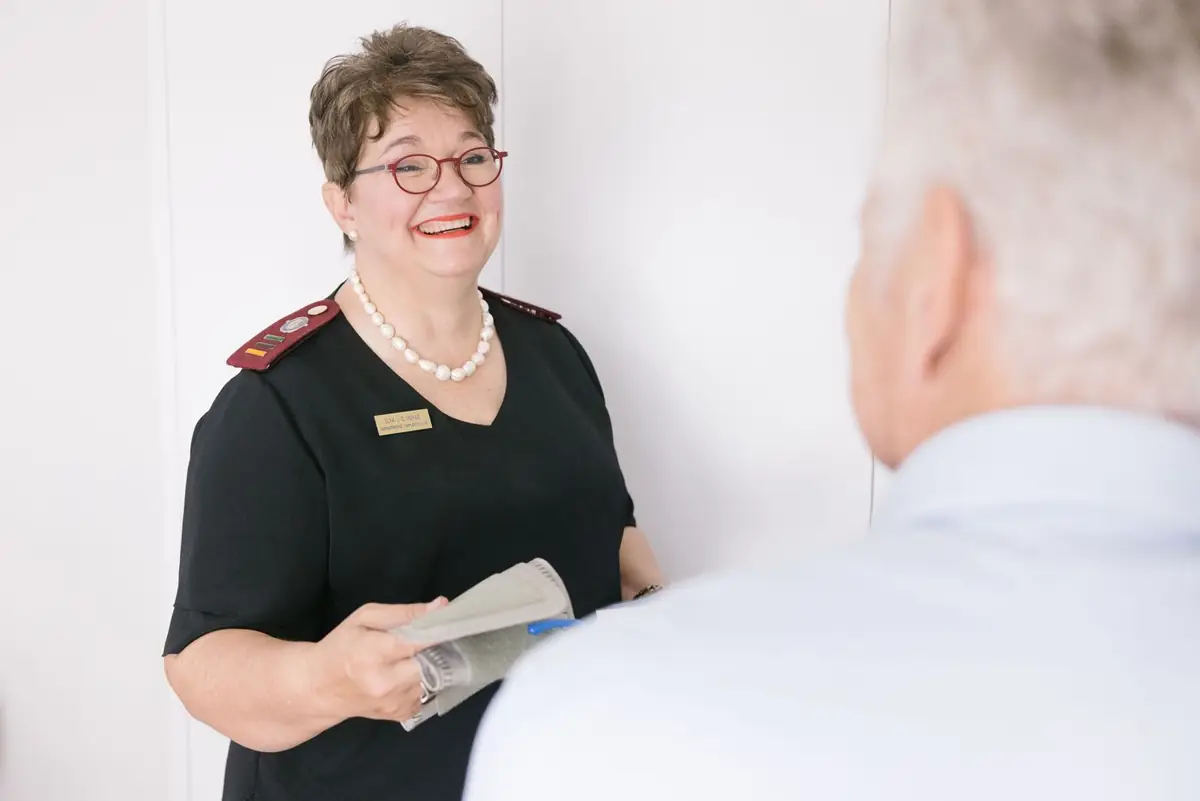 A Geratec nurse greeting a resident